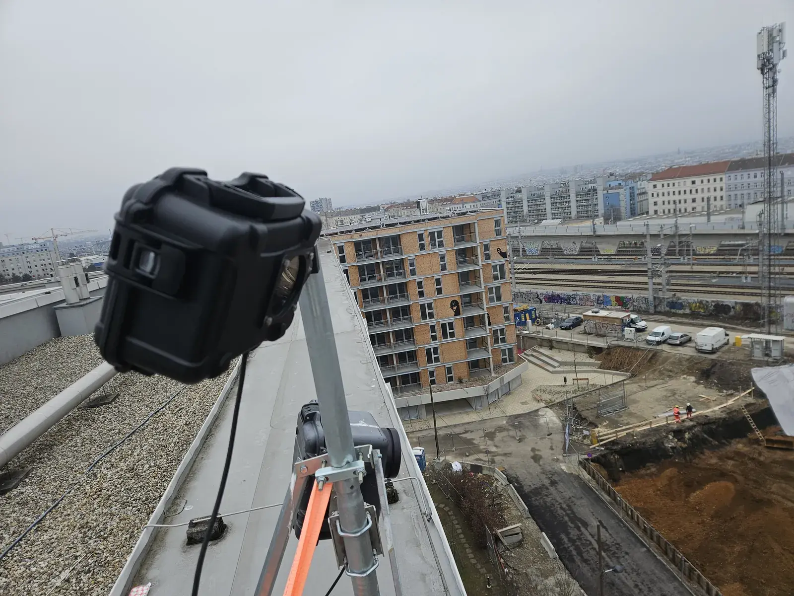 Weatherproof camera on a rooftop above a construction site